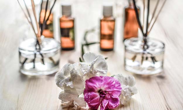 What is Aromatherapy? Bottles of Essential Oils, Reed Diffusers, Flowers