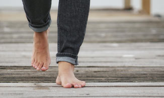 Man Walking Around Barefoot.