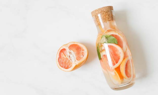Grapefruit Pieces in a Bottle and the Benefits of Using Grapefruit.