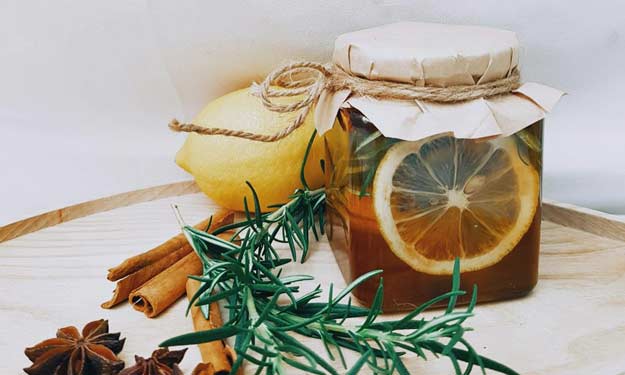 A Jar of Honey Infused with Garlic, Lemon, Ginger, Cinnamon for Cough Syrup.