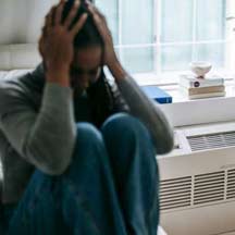 Woman Holding Her Head